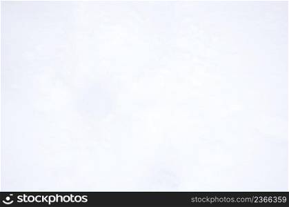 Snow texture in blue tone. Snowy nature winter background. Background of fresh snow