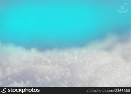 Snow texture in white tone. Snowy white surface as background. Background of fresh white snow. Natural winter background.