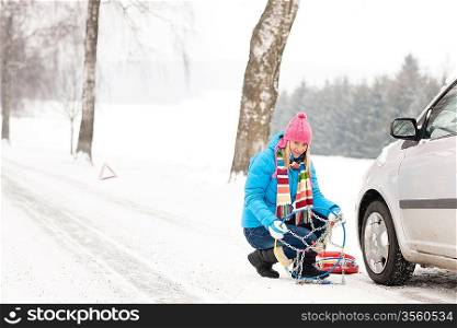 Snow tire chains winter car woman in trouble breakdown