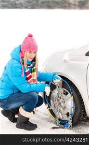 Snow tire chains winter car woman in trouble breakdown