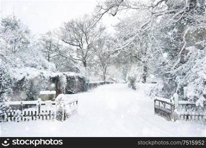Snow Winter landscape countryside scene with English countryside in heavy snow storm