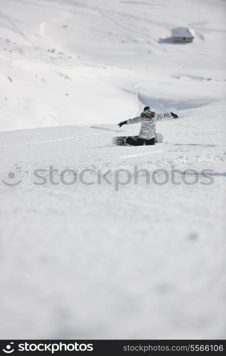 snowboard woman racing downhill slope and freeride on powder snow at winter season and sunny day