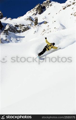 Snowboarder coming down hill