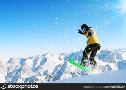 Snowboarder in jump. Man on snowboard jumping in sky. Summer vacation