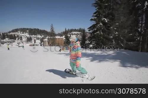 Snowboarder perform tricks