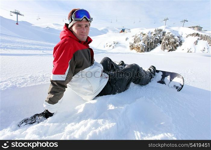 Snowboarder sat taking a little break