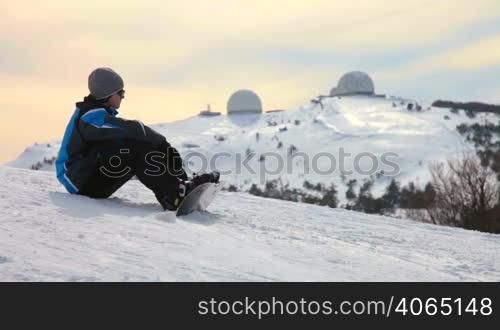 Snowboarder taking a break during their training lesson. Ai-Petri, Crimea