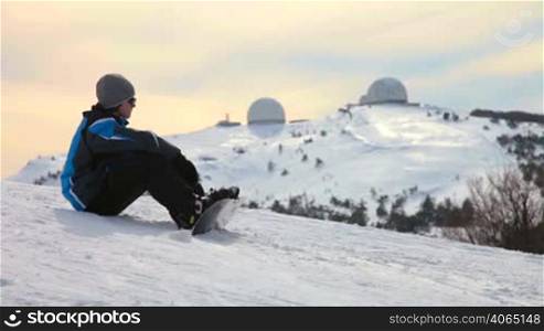 Snowboarder taking a break during their training lesson. Ai-Petri, Crimea