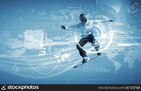 Snowboarding. Male snowboarder making jump against media background