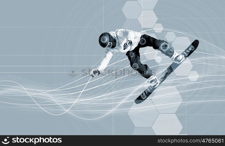 Snowboarding. Male snowboarder making jump against media background