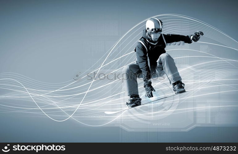 Snowboarding. Male snowboarder making jump against media background