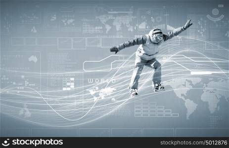 Snowboarding. Male snowboarder making jump against media background