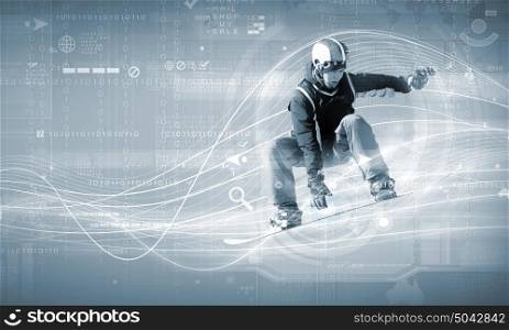 Snowboarding. Male snowboarder making jump against media background