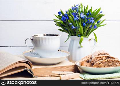 snowdrops in a vase on a table on a white background. Easter