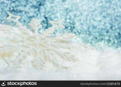 Snowflake big close up. Bokeh a background. Toning is blue