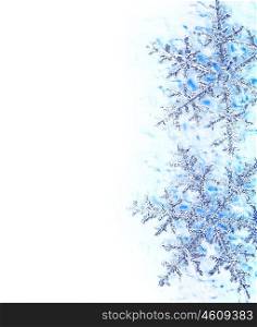 Snowflake blue decorative border, beautiful blue cold frozen snow background, Christmas tree ornament and decoration, winter holidays, abstract seasonal nature pattern with text space