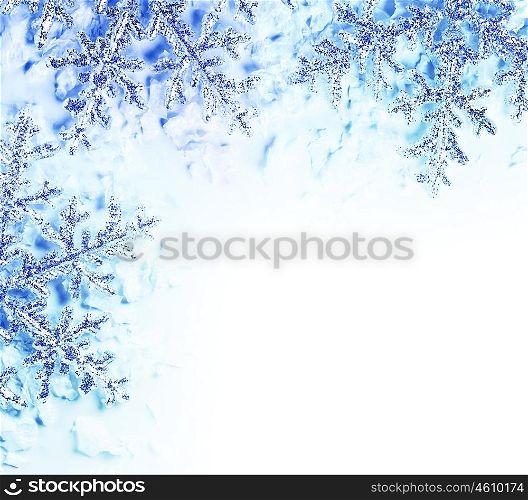 Snowflake decorative border, beautiful blue cold frozen snow background, Christmas tree ornament and decoration, winter holidays abstract frame with text space