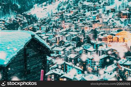 snowing in Zermatt traditional Swiss ski resort under the Matterhorn