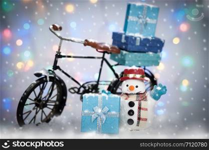 Snowman Cycling in the snow on bokeh background, AF point selection and make snowflake.