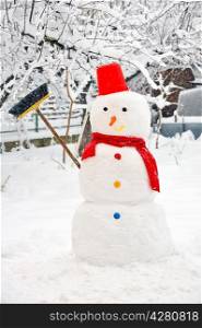 snowman on snowy garden