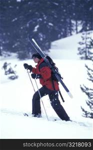 Snowshoeing with Skis Strapped on Back