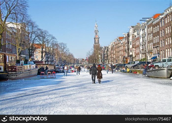Snowy Amsterdam with the Westerkerk in the Netherlands in winter