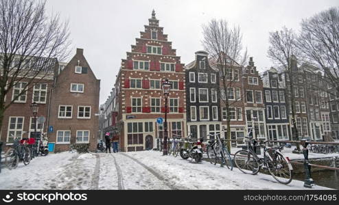 Snowy city Amsterdam in the Netherlands in winter