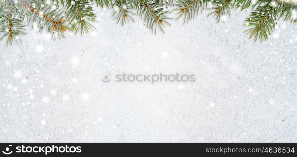 snowy glittering christmas or new year background. christmas card or new year background made of glittering snowflakes with fir-tree branches