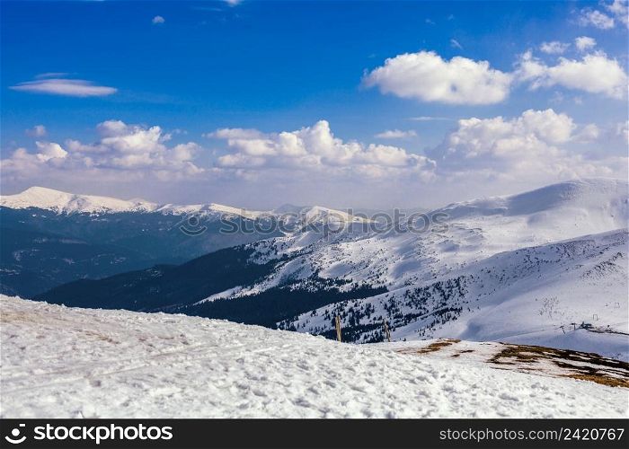 snowy mountain landscape against blue sky