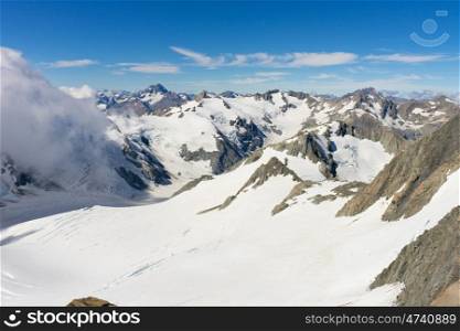 Snowy mountain peak. Mountain landscape with snow and clear blue sky