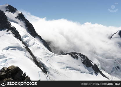 Snowy mountain peak. Mountain landscape with snow and clear blue sky