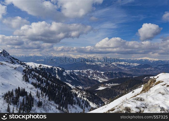 Snowy Mountains and cloudy skies
