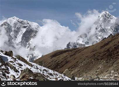 snowy mountains. High mountains in cloud. Nepal. Everest