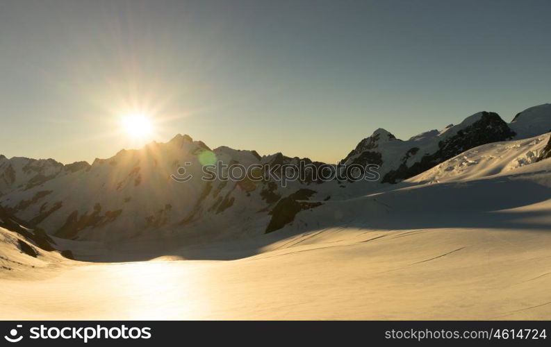 Snowy mountains. Mountain landscape with snow and clear blue sky