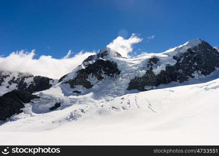 Snowy mountains. Mountain landscape with snow and clear blue sky