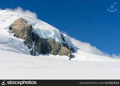 Snowy mountains. Mountain landscape with snow and clear blue sky