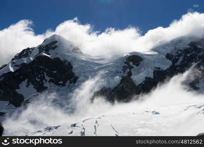 Snowy mountains. Mountain landscape with snow and clear blue sky