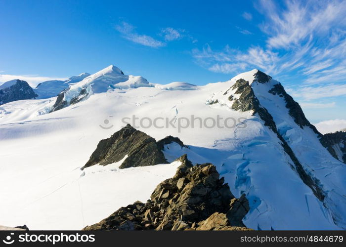 Snowy mountains. Mountain landscape with snow and clear blue sky