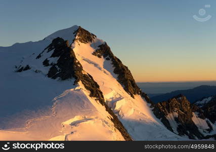 Snowy mountains. Mountain landscape with snow and clear blue sky