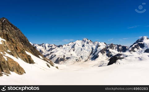 Snowy mountains. Mountain landscape with snow and clear blue sky