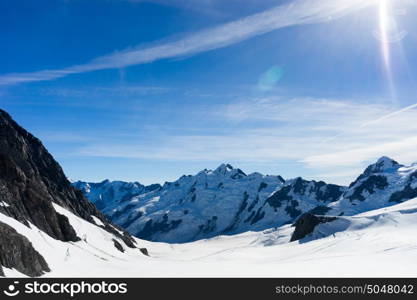 Snowy mountains. Mountain landscape with snow and clear blue sky