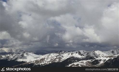 Snowy peaks camera tilt to blue sky