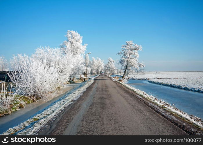 Snowy road in the countryside from the Netherlands in winter