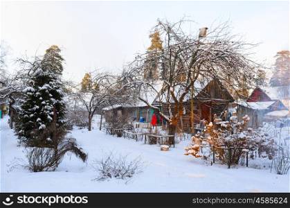 snowy rural house. rural house covered with snow in Russian village