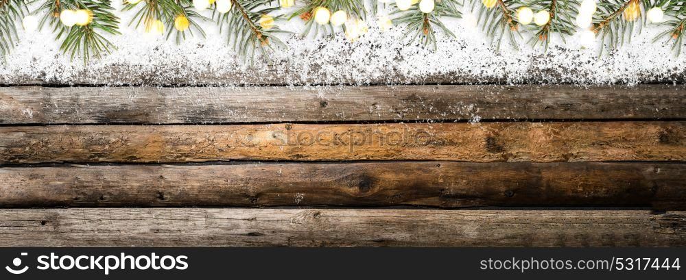 Snowy vintage wooden table. Christmas or New Year snowy vintage wooden table with fir tree