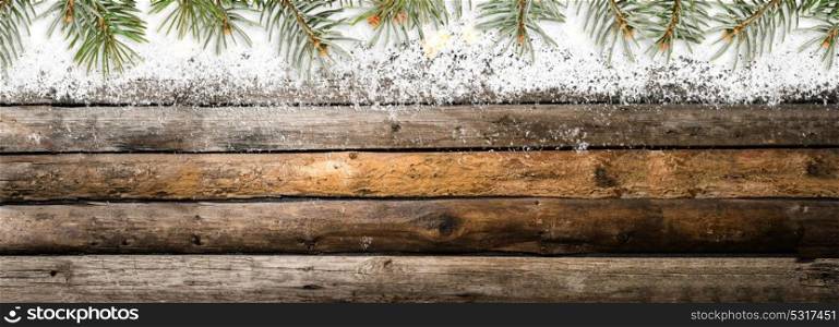 Snowy vintage wooden table. Christmas or New Year snowy vintage wooden table with fir tree