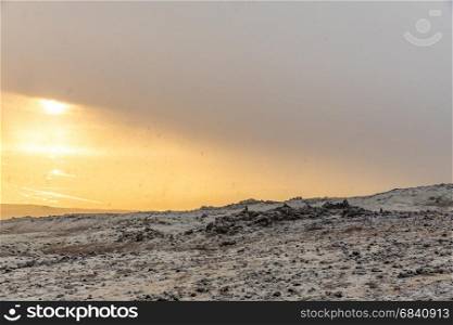 Snowy Winter Mountain range with sun light in Reykjavik Iceland