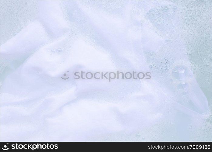 Soak a cloth before washing, white T-shirt