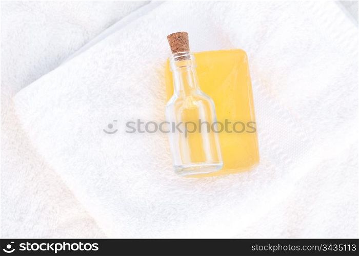 soap and bottles on a white towel
