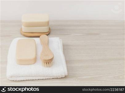 soap brush towel wooden tabletop